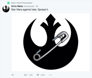 The makers of Rogue One have attached a safety pin, one of the symbols being tweeted and shared as a sign of opposition to Donald Trump, to a symbol of the Rebel Alliance, the Alliance Starbird.